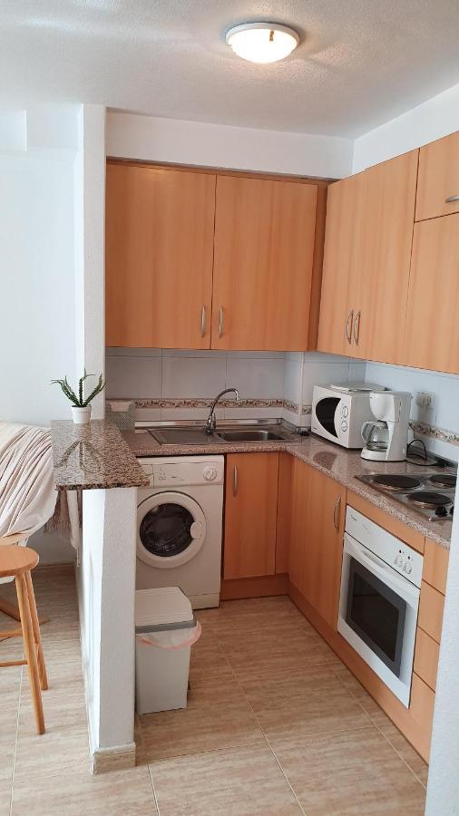 Apartment In Campoamor Overlooking The Swimming Pool Eksteriør billede