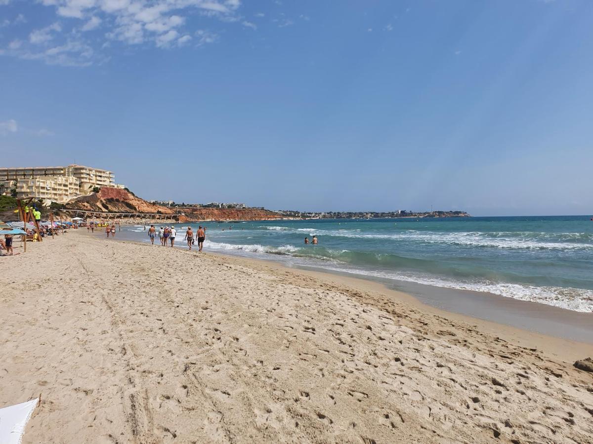 Apartment In Campoamor Overlooking The Swimming Pool Eksteriør billede