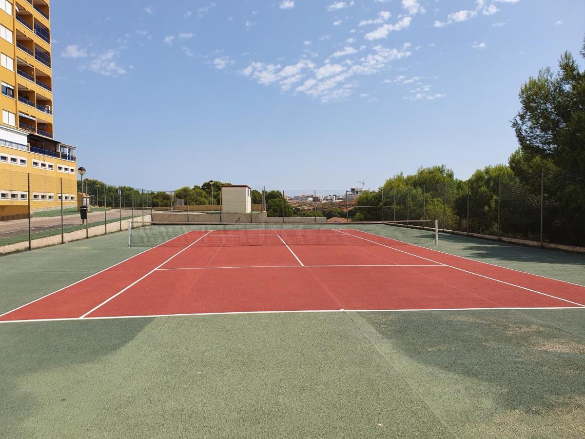 Apartment In Campoamor Overlooking The Swimming Pool Eksteriør billede